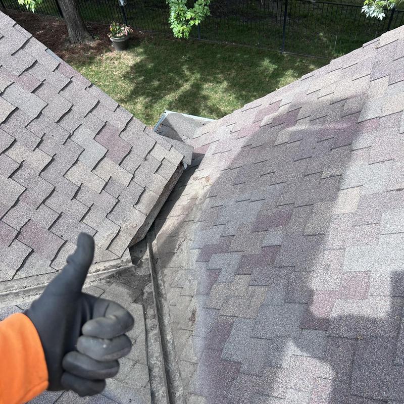 Roof valley with cleaned debris and intact shingles Roof valley with cleaned debris and intact shingles