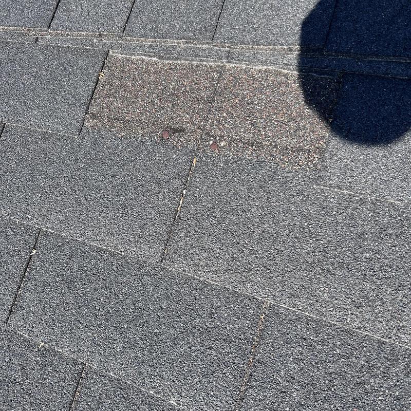 3-tab shingles showing wear and granule loss 3-tab shingles showing wear and granule loss