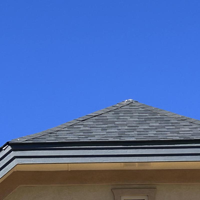 Malarkey ridge shingles on steep roof peak Malarkey ridge shingles on steep roof peak