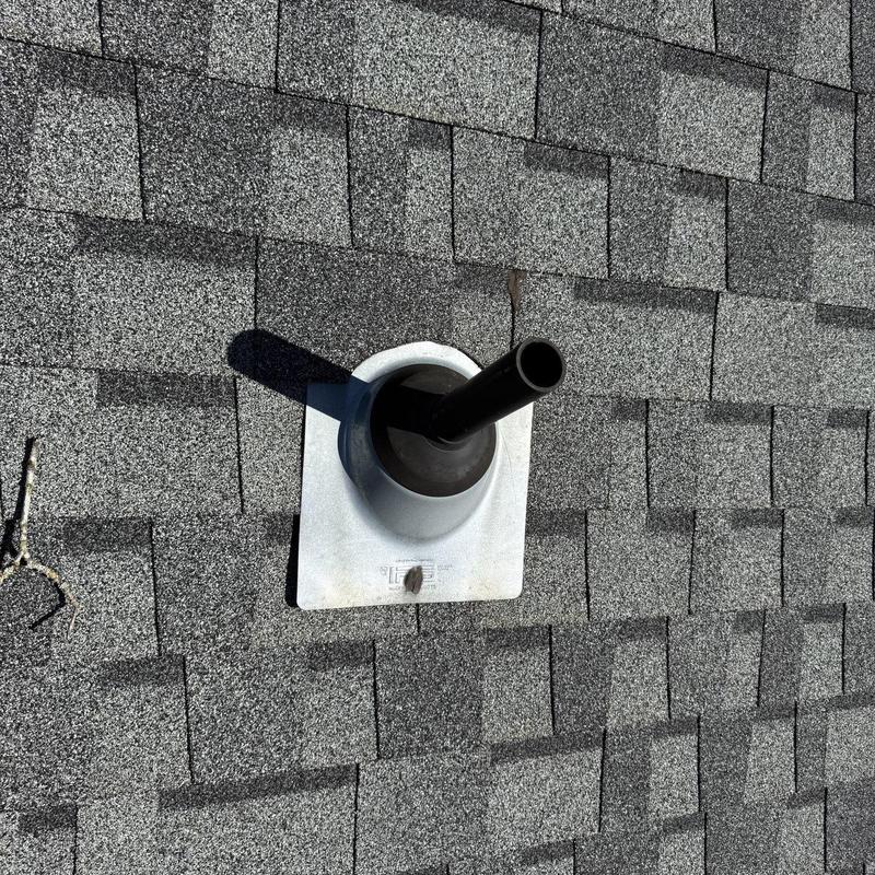 Roof pipe boot installation on asphalt shingles