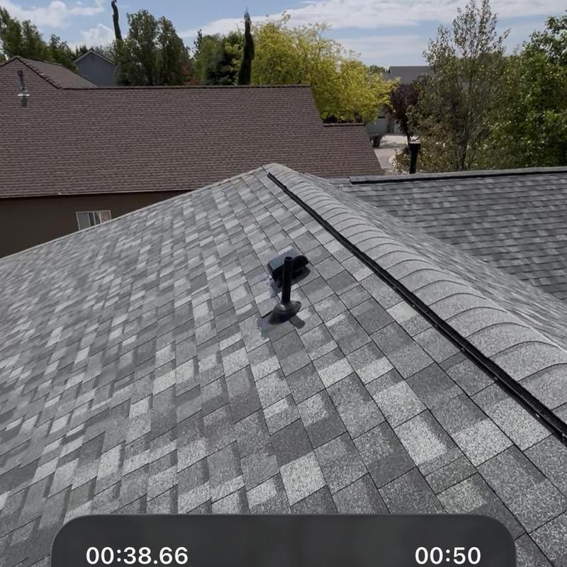 Estate gray roof shingles with ridge vent and vent pipe Estate gray roof shingles with ridge vent and vent pipe