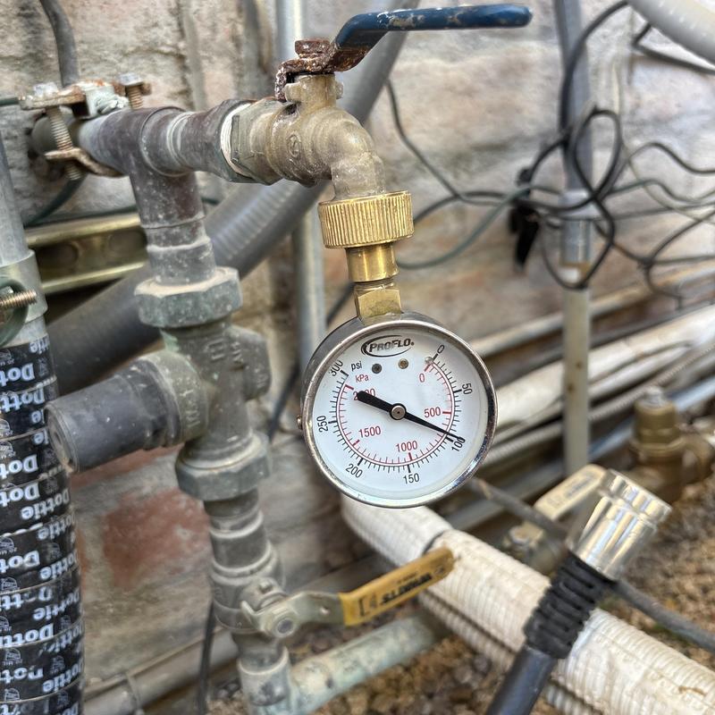 Pressure gauge on outdoor water pipe system