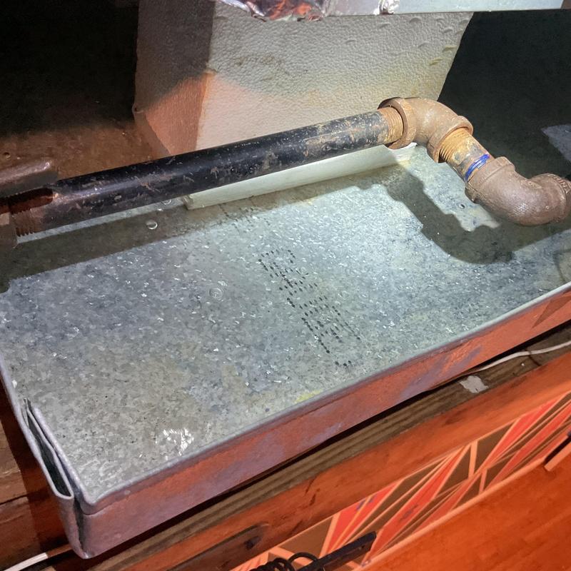 Condensate drain line with backup in emergency pan Condensate drain line with backup in emergency pan