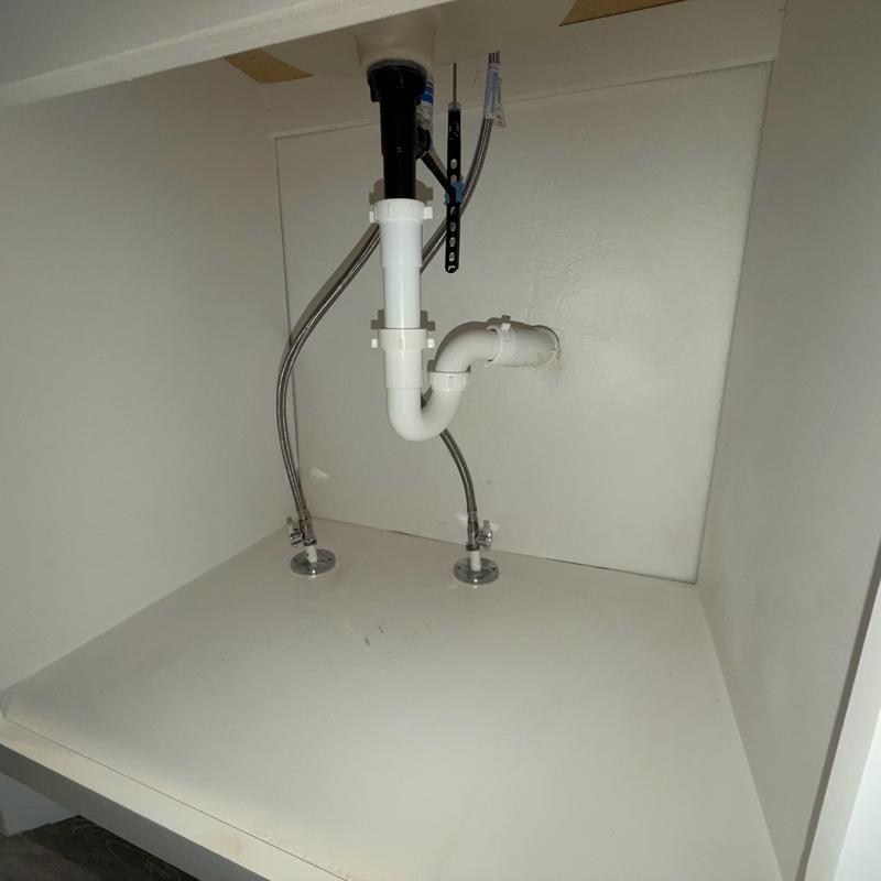 P-trap assembly under kitchen sink with water lines P-trap assembly under kitchen sink with water lines