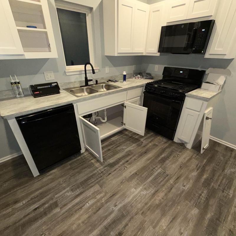 Kitchen sink plumbing with black faucet installation Kitchen sink plumbing with black faucet installation