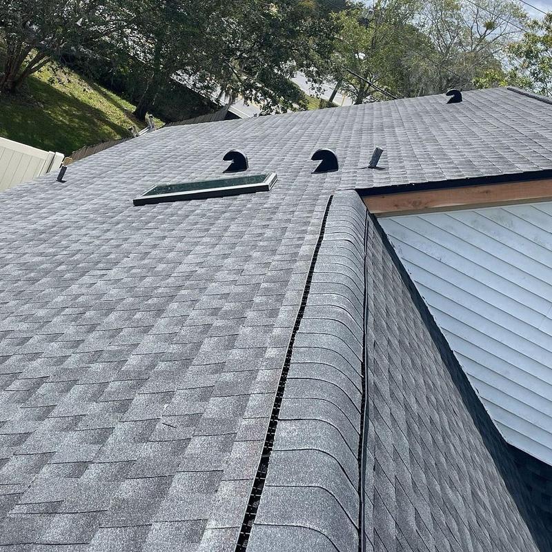 Architectural shingle roof with ridge vent and skylight Architectural shingle roof with ridge vent and skylight