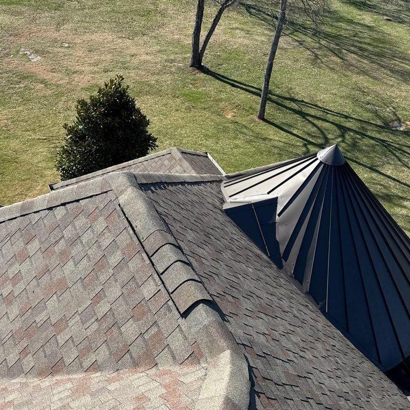 Asphalt shingle roof with metal turret inspection