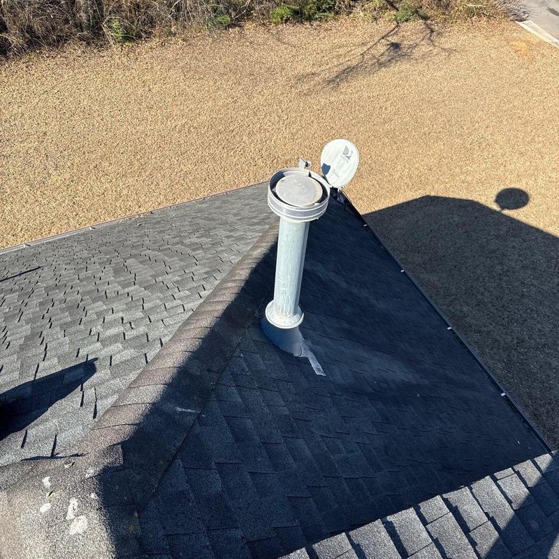 Roof vent flashing on asphalt shingle roof flooring