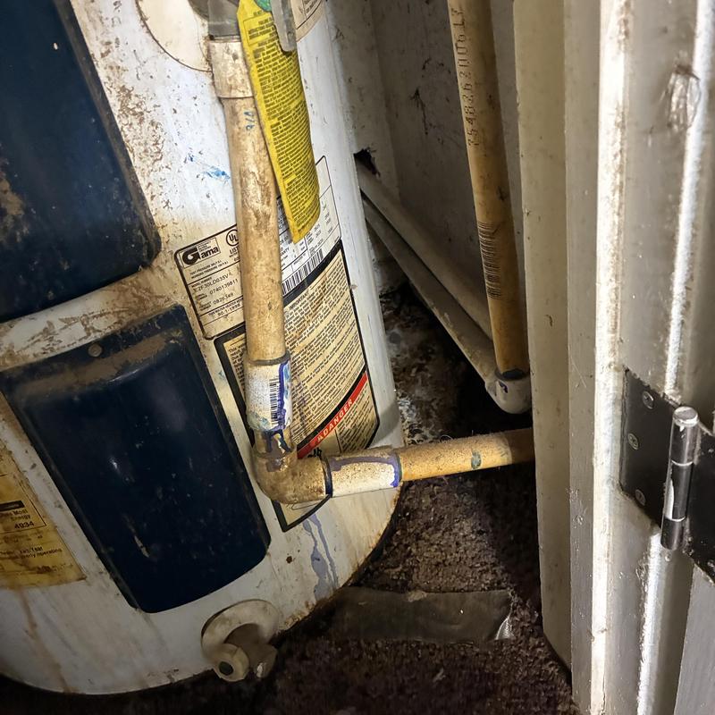 Low boy water heater with corroded supply lines