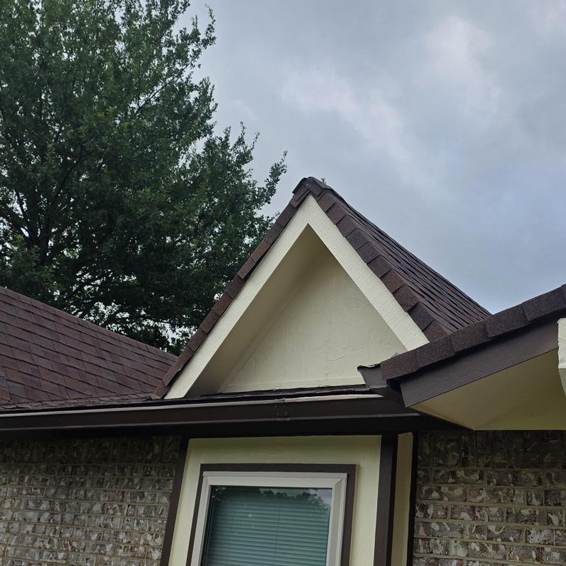 Roof shingles with hail damage on residential home