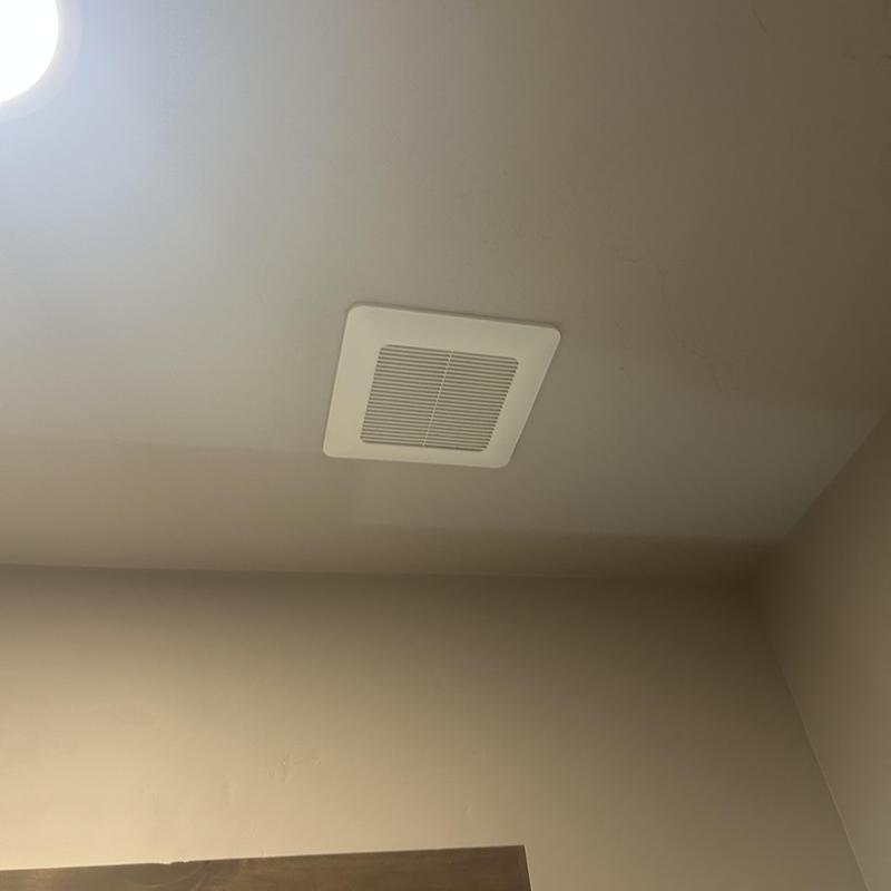 Bathroom exhaust fan vent installed on ceiling