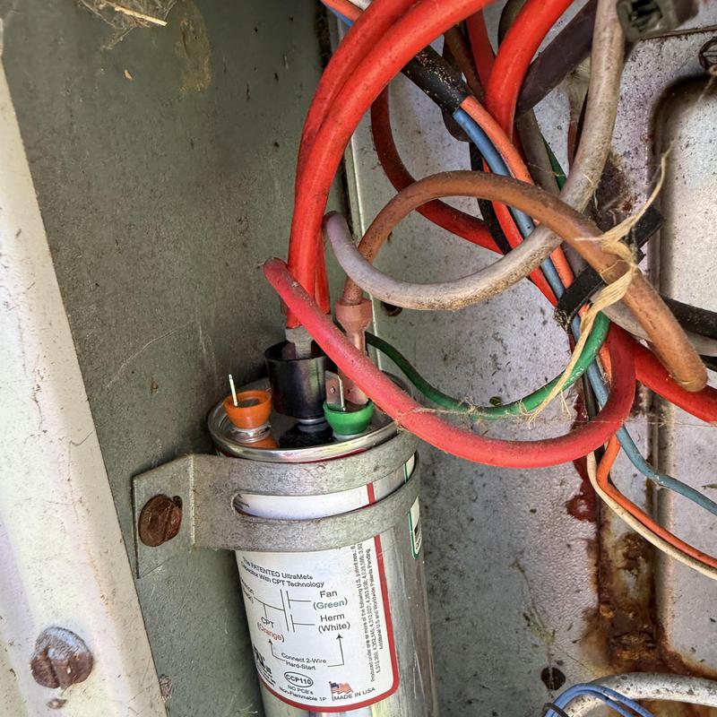 AC capacitor with wiring in HVAC unit panel AC capacitor with wiring in HVAC unit panel