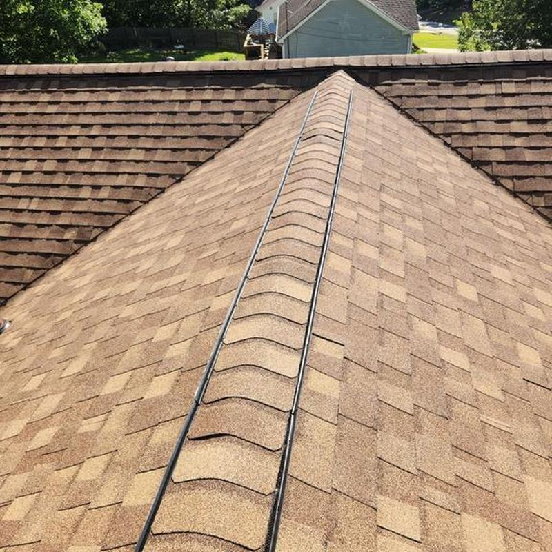 Ridge vent installation on asphalt shingle roof