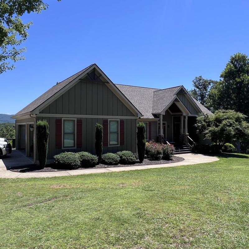 Roof replacement with decorative wood beam restoration and gutter repair
