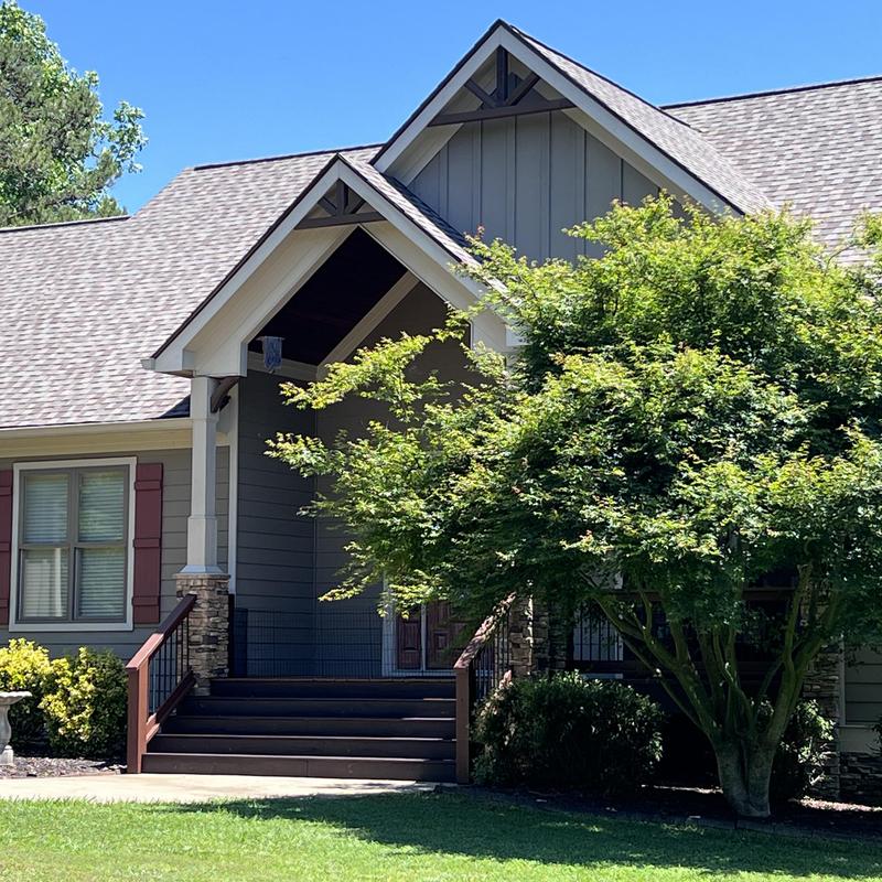 Asphalt shingle roof with wooden beam and gutter repair