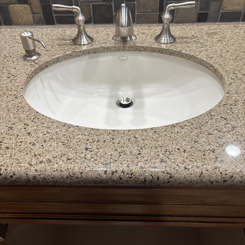 Widespread lavatory faucet and granite countertop installation