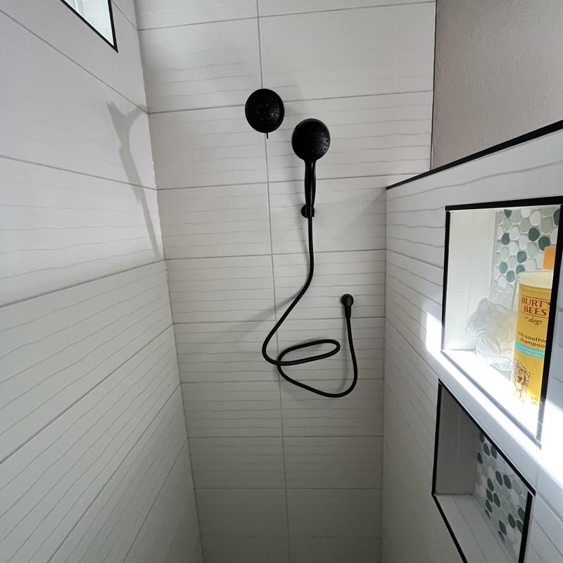 Walk-in shower drain and black shower trim installation Walk-in shower drain and black shower trim installation