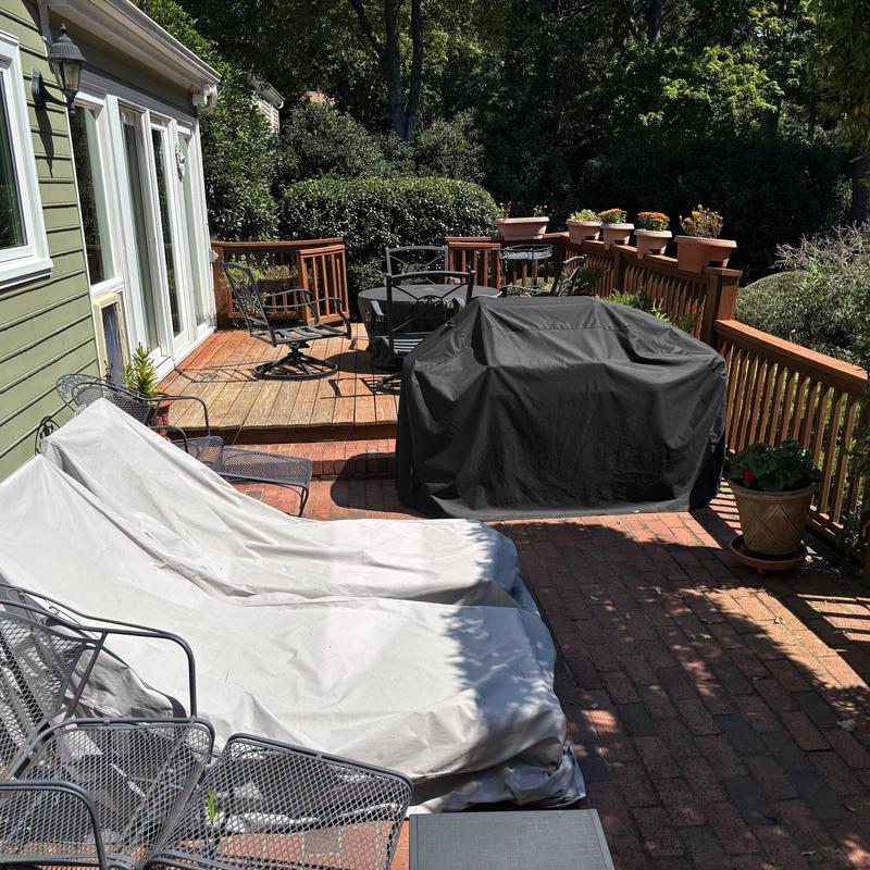 Wooden deck with patio furniture and grill covers Wooden deck with patio furniture and grill covers