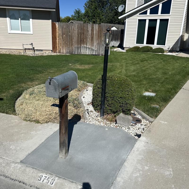 Yard light pole with concrete base and mailbox post