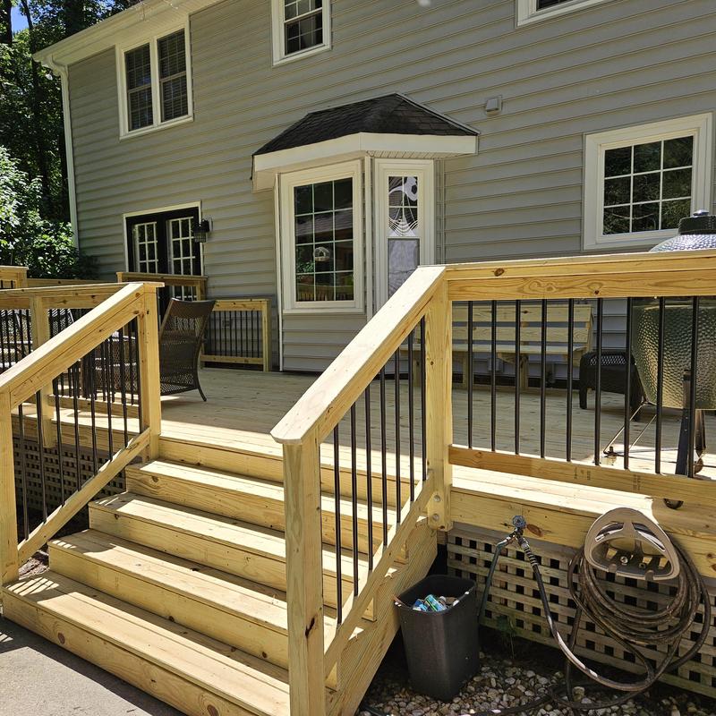 Wooden deck stairs and railing with iron balusters Wooden deck stairs and railing with iron balusters