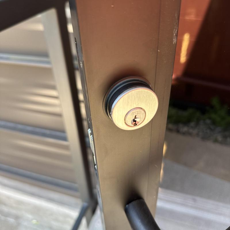 Commercial door lock on metal frame with handle