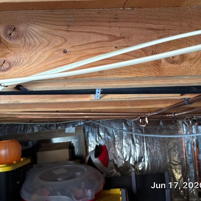 Copper type L water pipe installed beneath wooden joists Copper type L water pipe installed beneath wooden joists