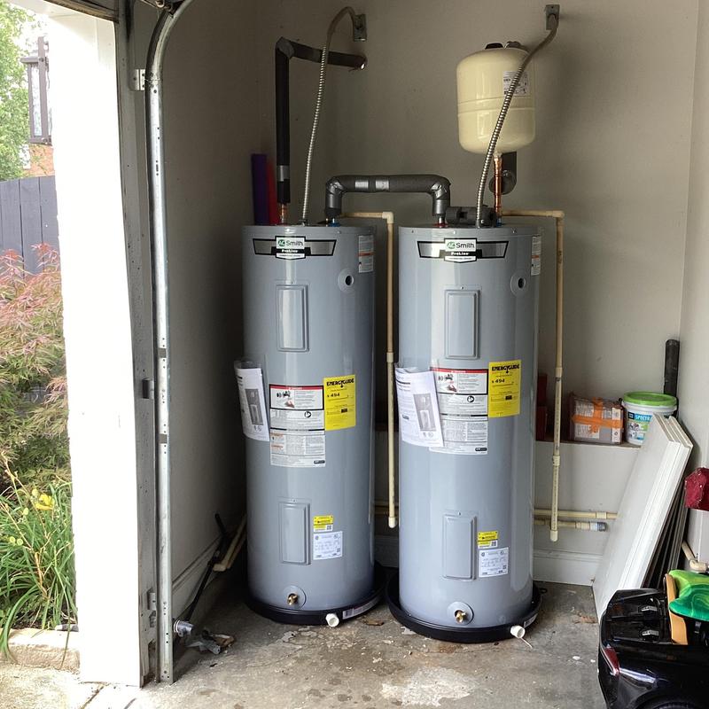 Electric water heaters with expansion tank installed in garage