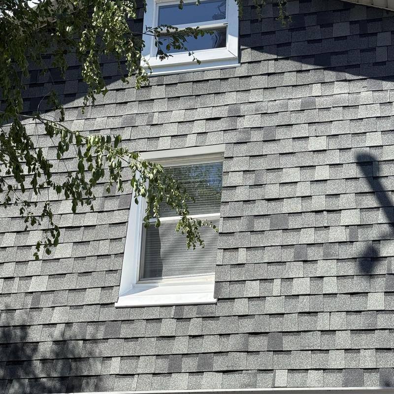 Atlas Pinnacle Pristine asphalt shingles on residential wall Atlas Pinnacle Pristine asphalt shingles on residential wall
