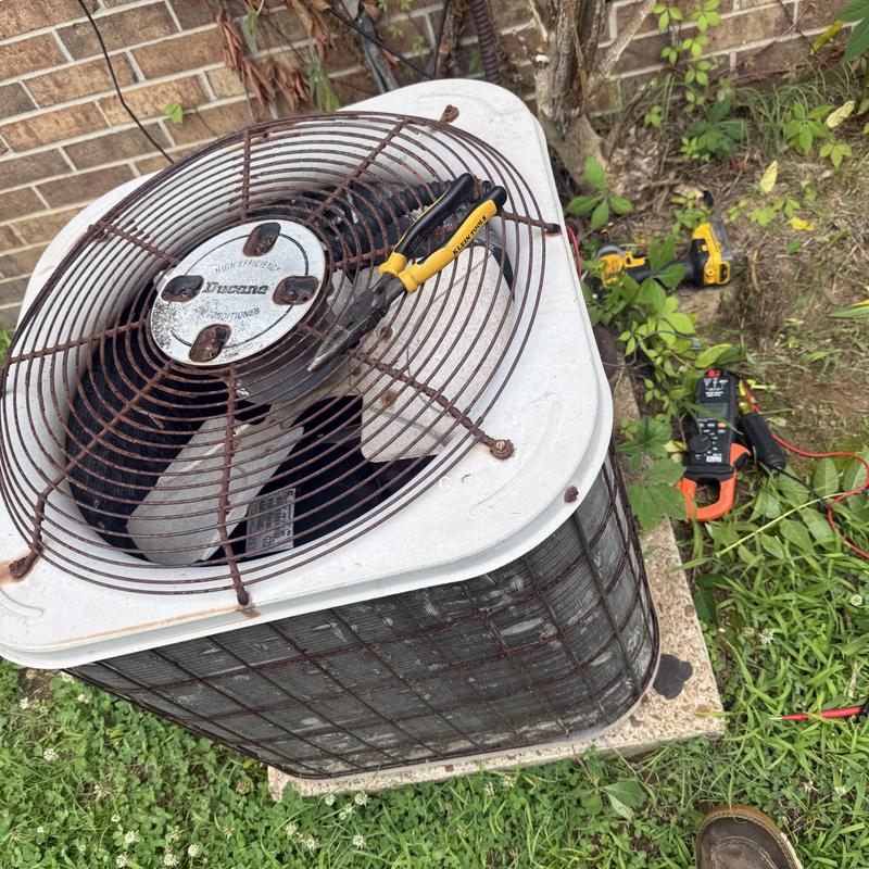 R22 air conditioner condenser with tools on top R22 air conditioner condenser with tools on top