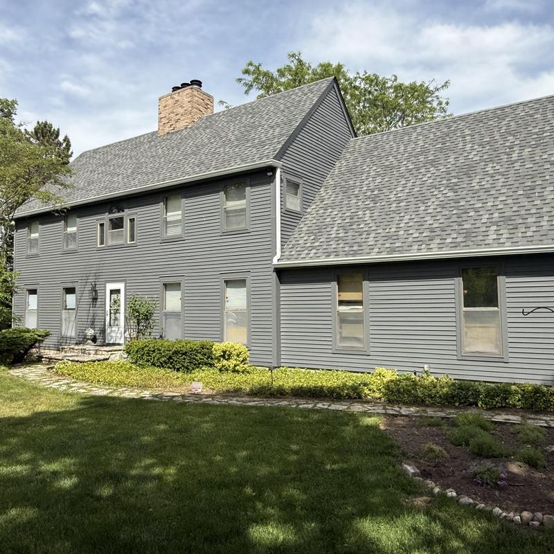 Atlas impact-resistant roof with gutter guards on house Atlas impact-resistant roof with gutter guards on house
