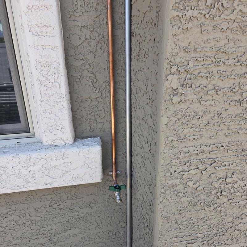 Copper hose bib on exterior wall with valve Copper hose bib on exterior wall with valve