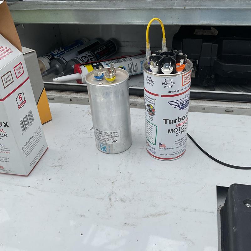 Motor start capacitors on HVAC service truck shelf Motor start capacitors on HVAC service truck shelf