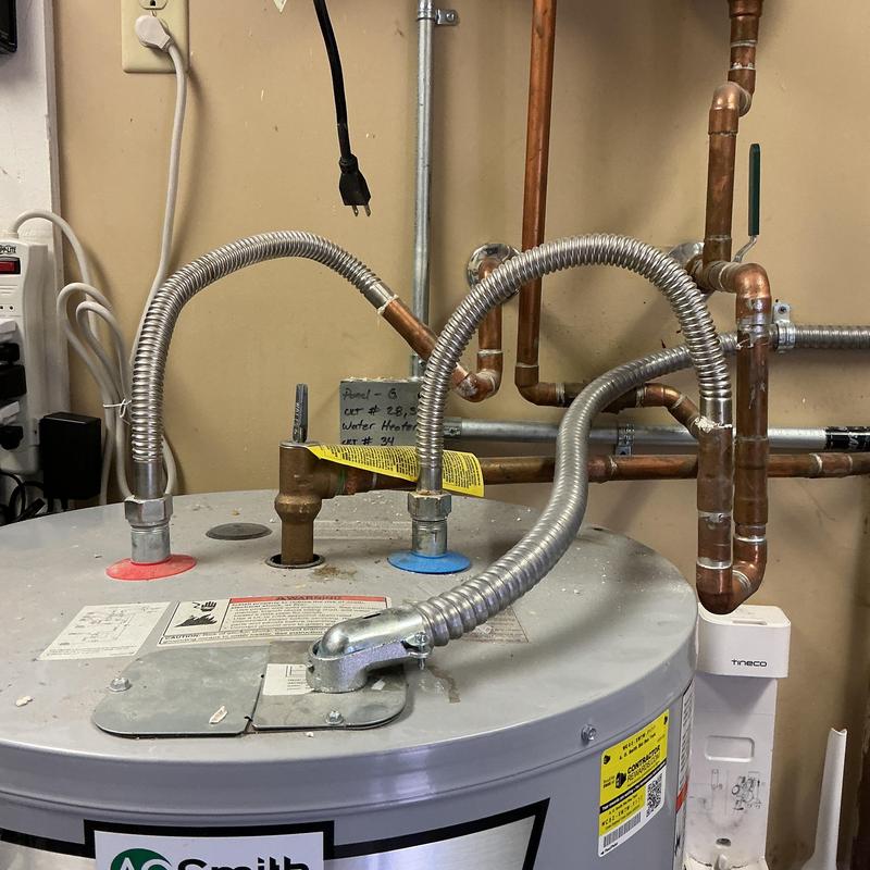 Water heater with copper piping and flexible connectors
