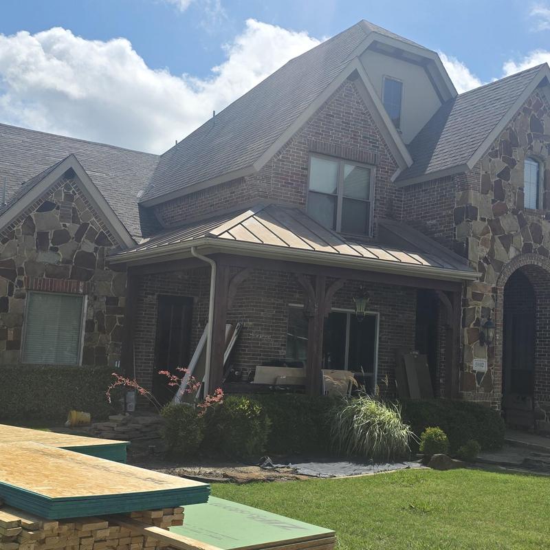 Metal porch roof with hail damage in Terrell, TX