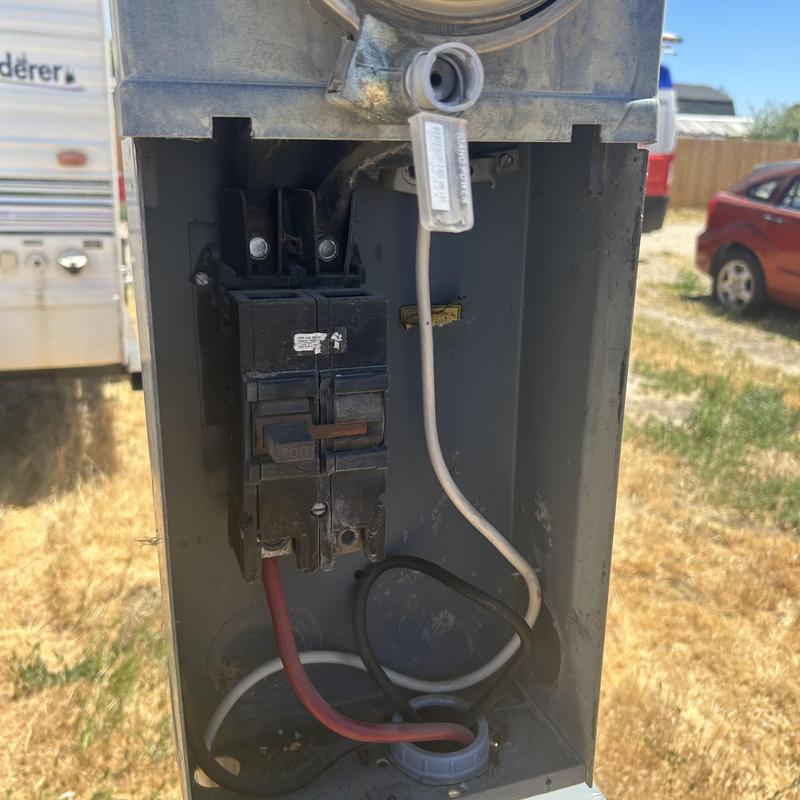 Challenger meter main with circuit breakers and wires Challenger meter main with circuit breakers and wires