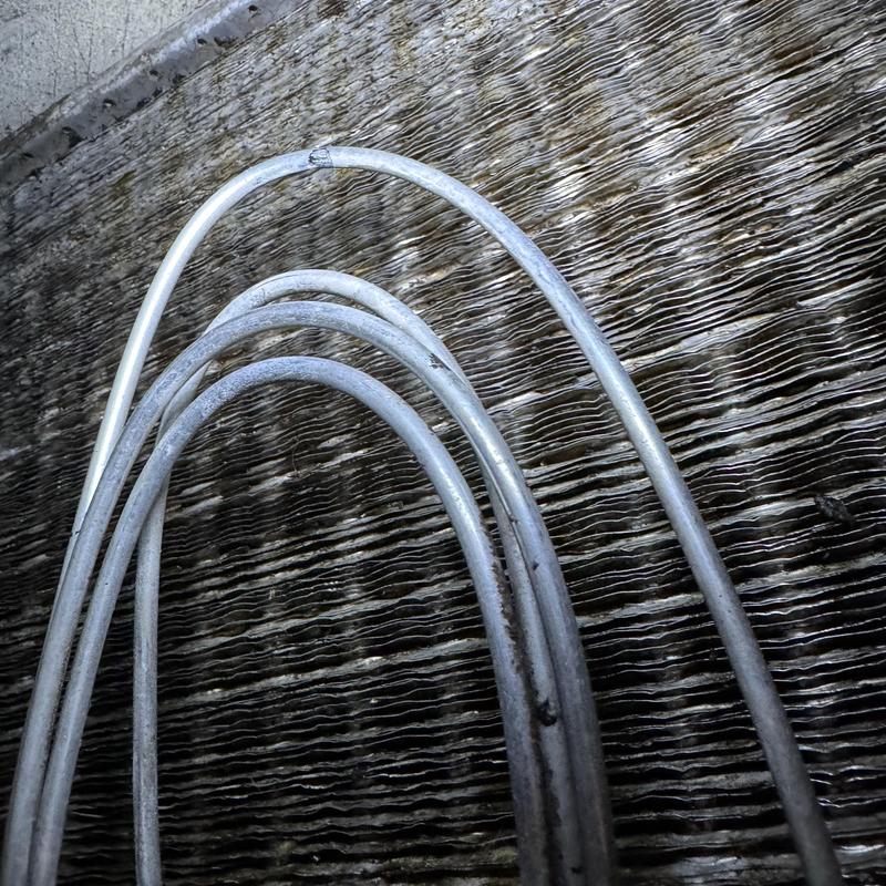 Evaporator coil fins with bent and straightened aluminum tubing Evaporator coil fins with bent and straightened aluminum tubing