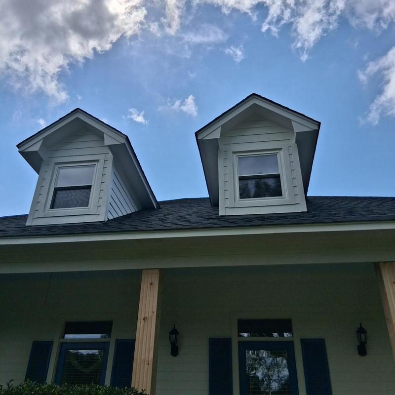 Insulated dormer windows on residential roof