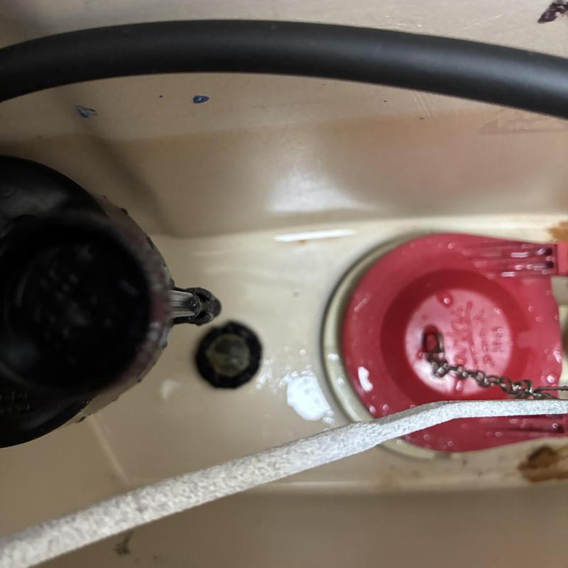 Toilet fill valve and flapper inside tank
