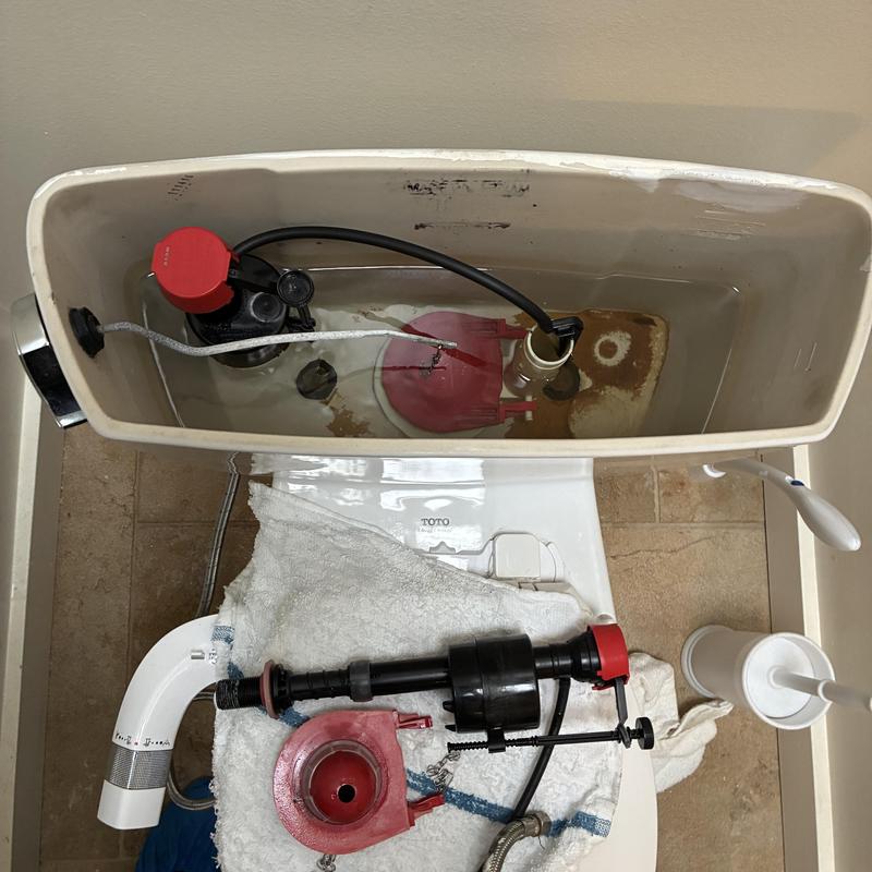 Toilet fill valve and flapper replacement in tank