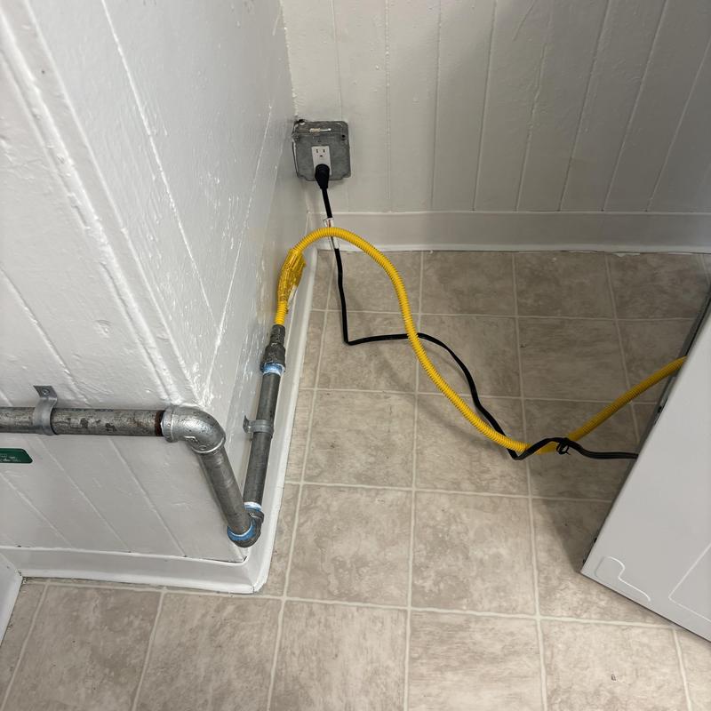 Gas line piping with yellow flexible connector installed
