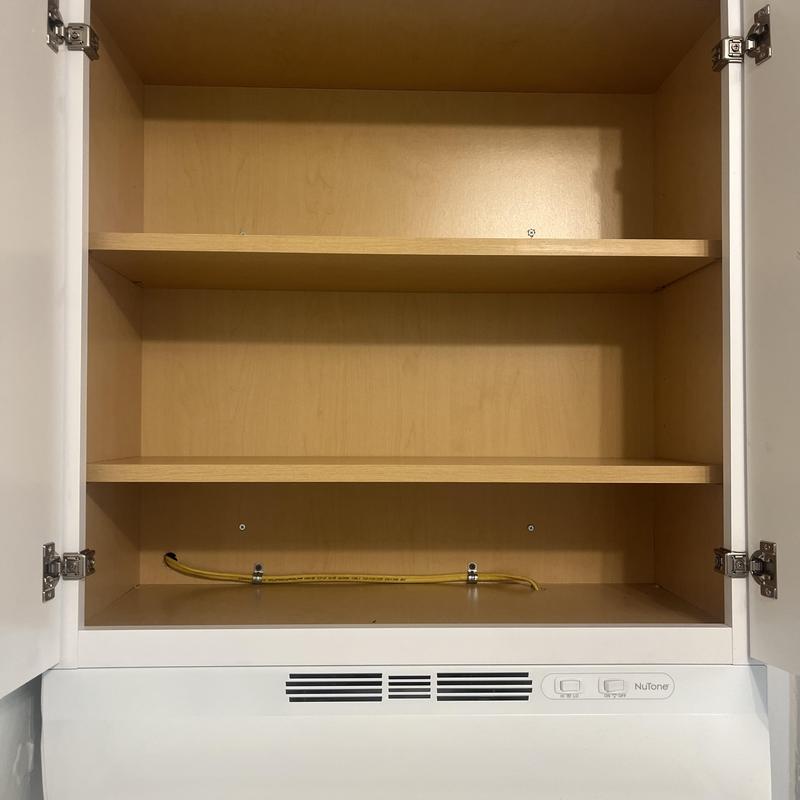 Kitchen cabinet with ventless range hood installed