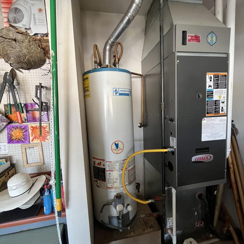 Water heater and furnace installation in utility room Water heater and furnace installation in utility room