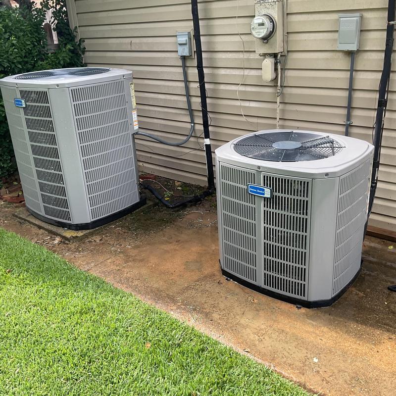 Condenser units on outdoor HVAC system during maintenance Condenser units on outdoor HVAC system during maintenance