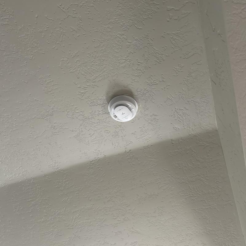 Smoke detector carbon monoxide combo on textured ceiling