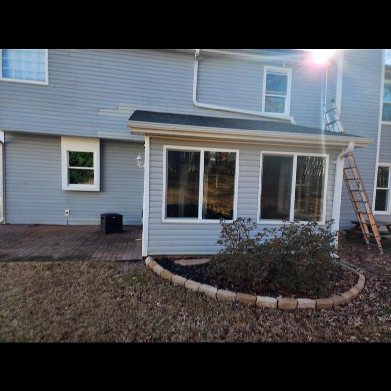 Sunroom roof and siding with ladder and garden bed