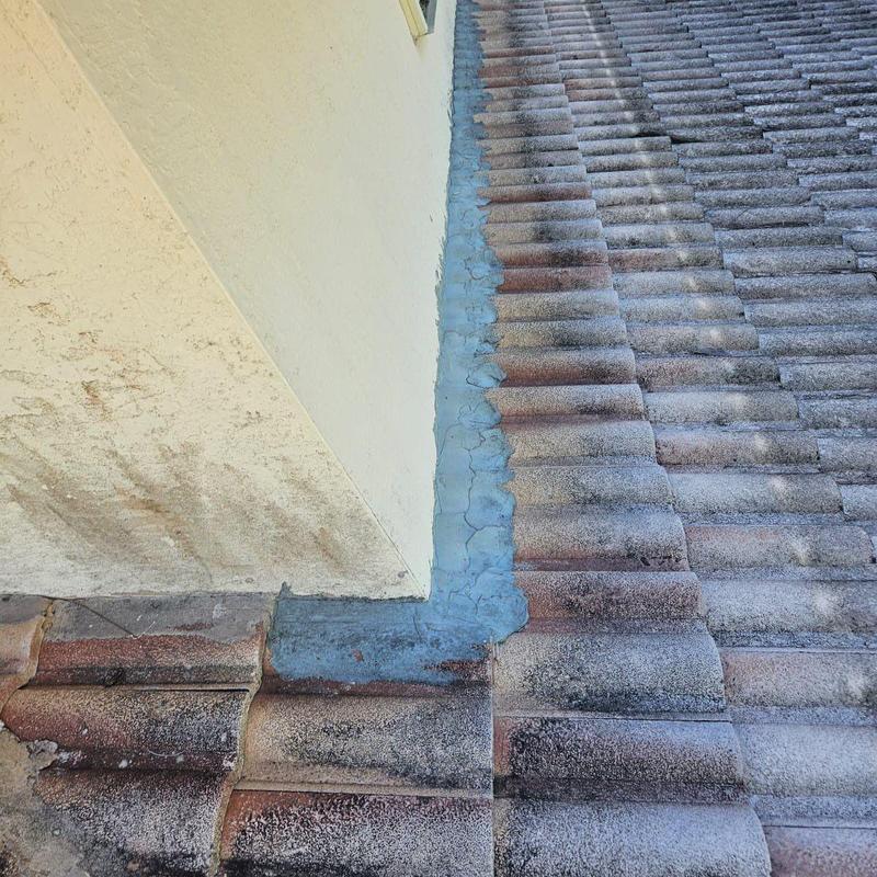 Concrete tile roof flashing with visible damage Concrete tile roof flashing with visible damage