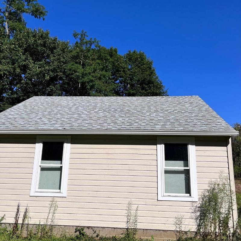 Asphalt shingle roof on beige siding house in Ivoryton CT Asphalt shingle roof on beige siding house in Ivoryton CT