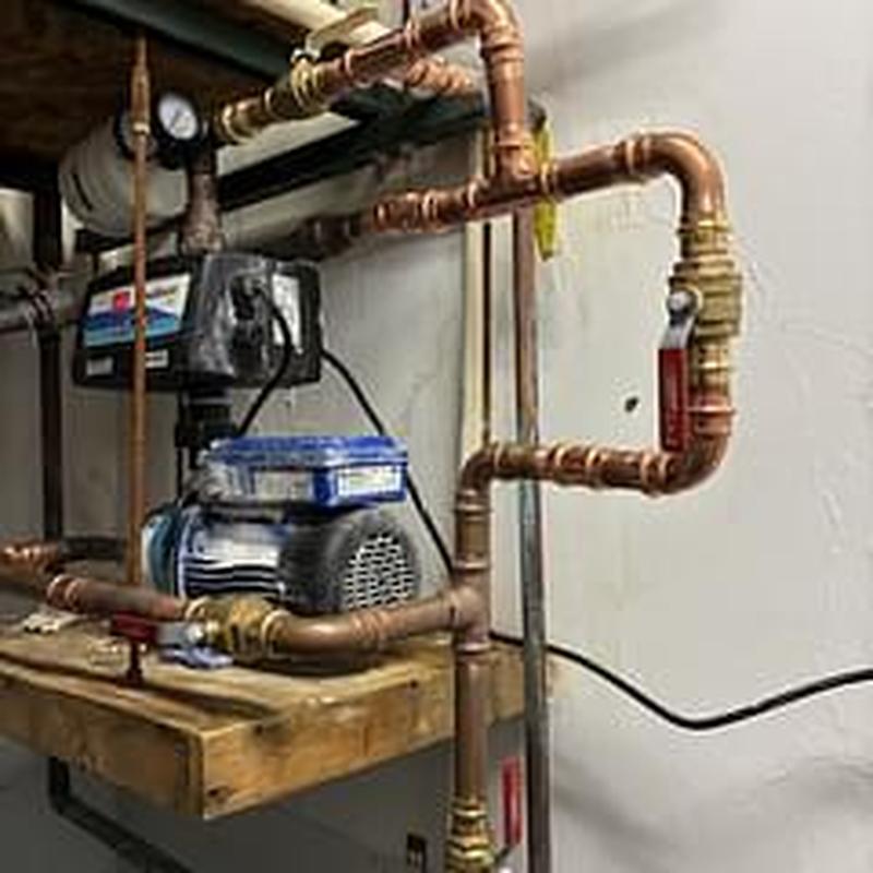 Booster pump with copper piping and valve assembly