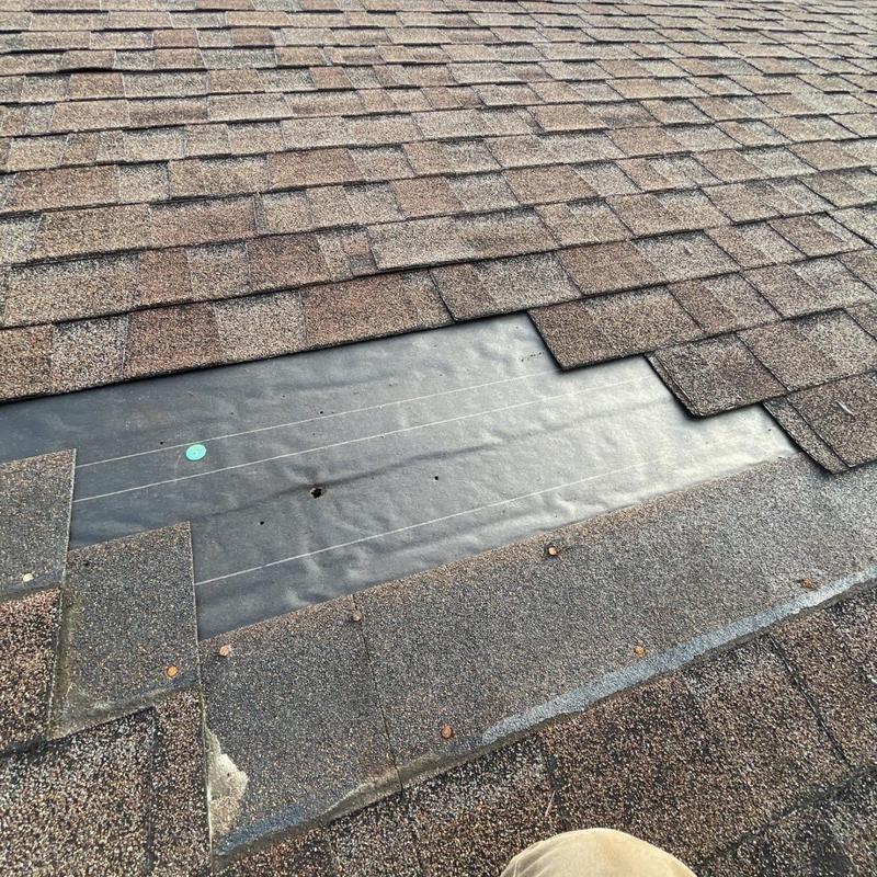 Roof underlayment exposed after shingle removal