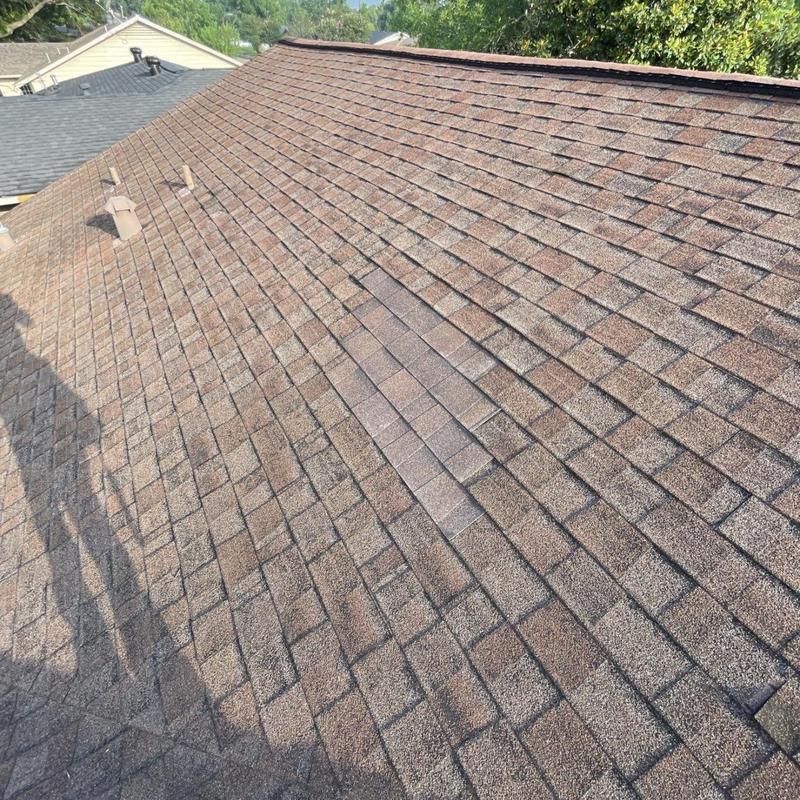 Asphalt shingles roof with matching patch repair